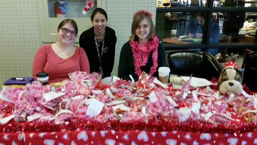 Member Recruitment: Members selling cookies at our annual "Sonnet Sale."